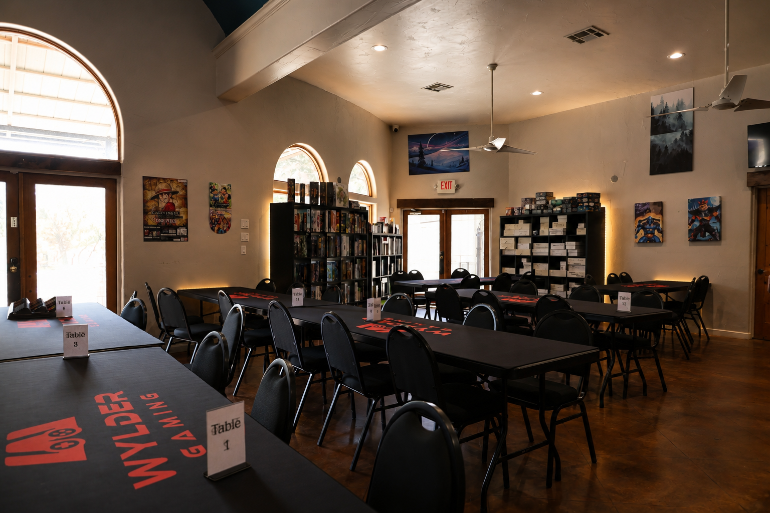 Wylder Gaming play room with numbered tables and shelves of board games